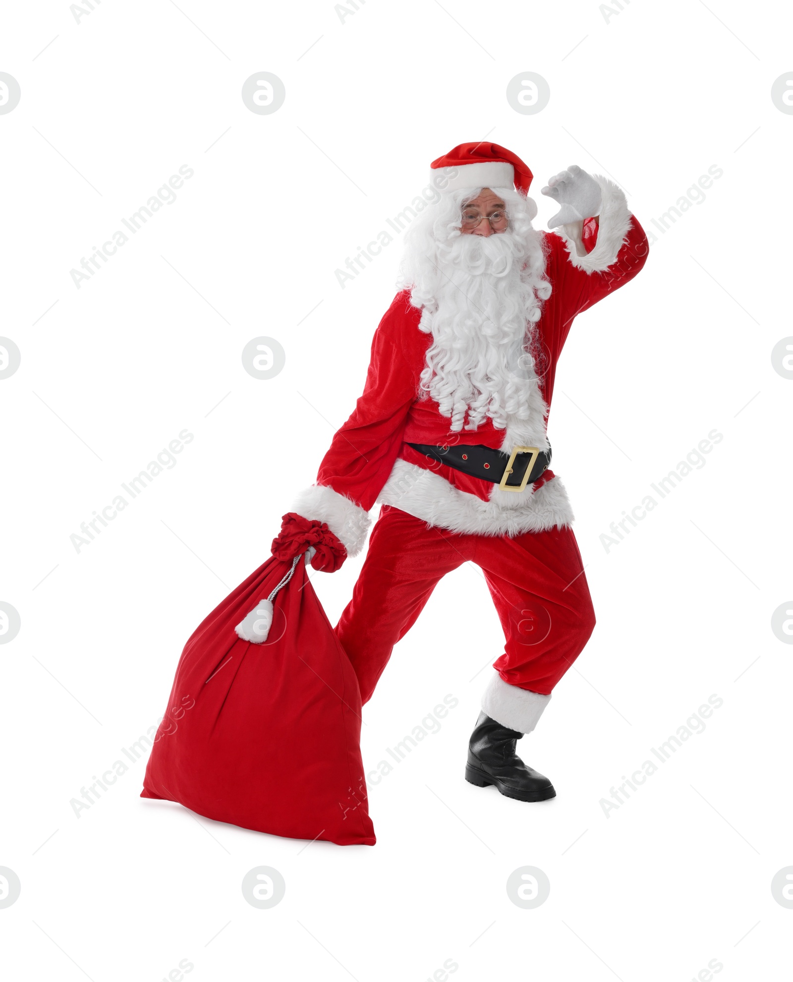 Photo of Man in Santa Claus costume with bag posing on white background