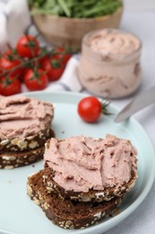 Photo of Delicious liverwurst sandwiches served on white table, closeup