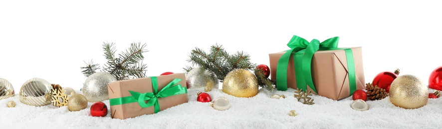 Photo of Fir branches, Christmas decoration and snow against white background