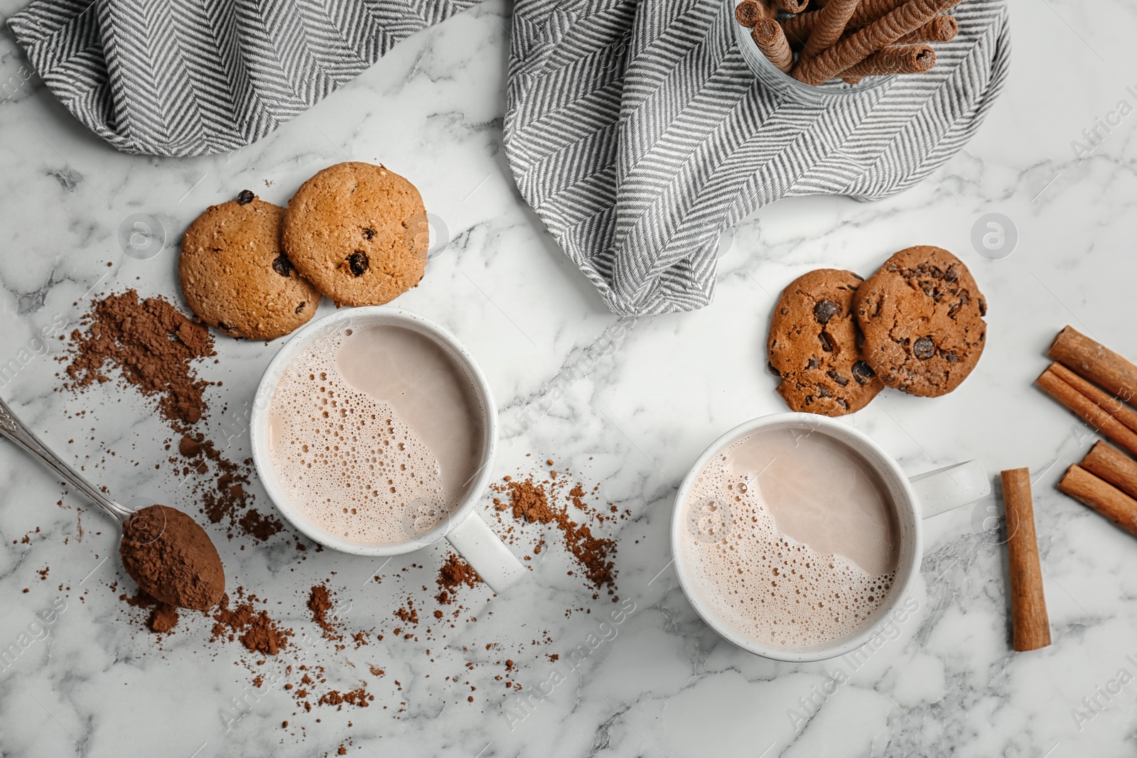 Photo of Flat lay composition with hot cocoa drink and cookies on light background