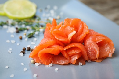 Photo of Plate with fresh sliced salmon fillet, closeup