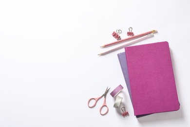 Photo of Composition with scissors and stationery on white background, top view
