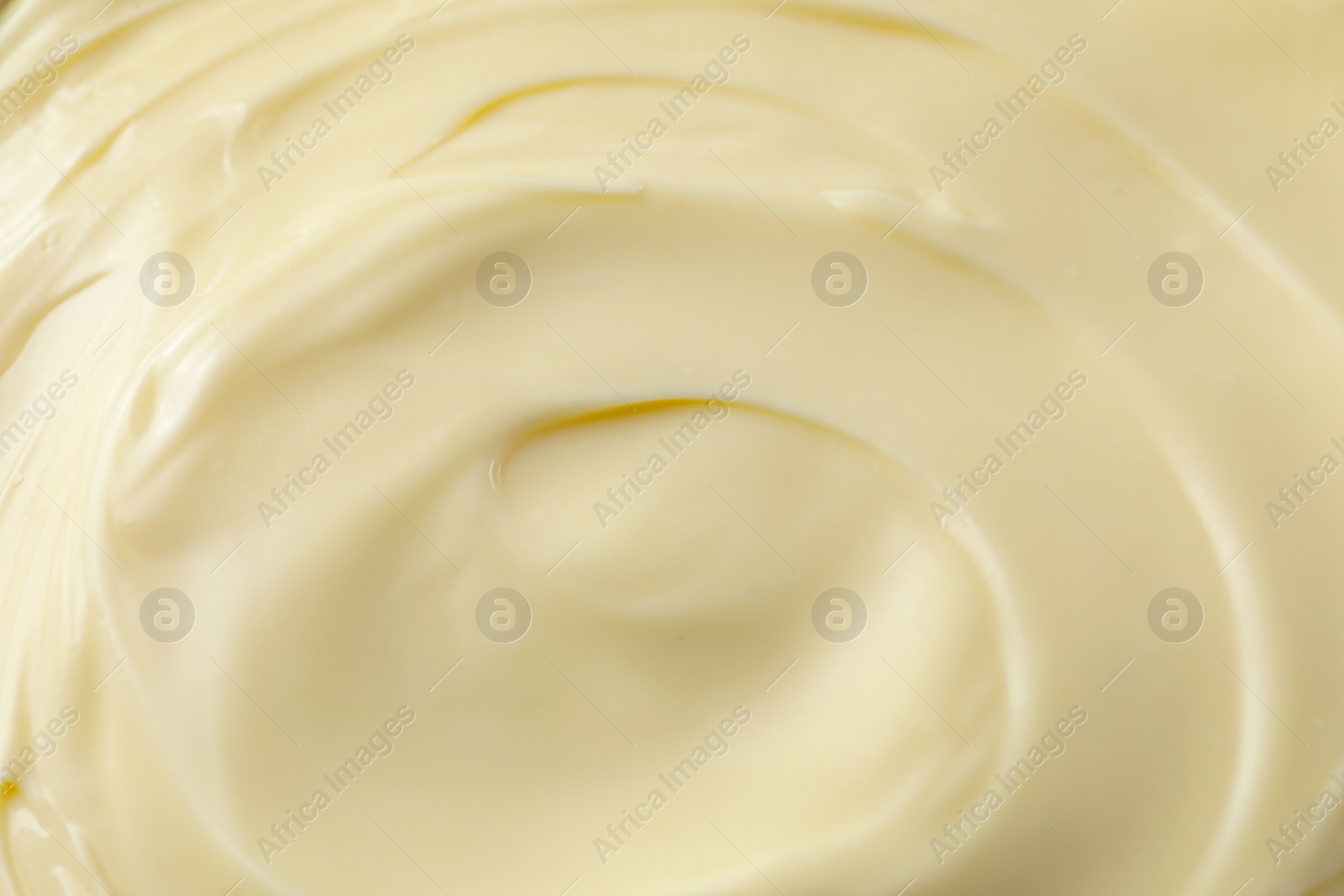 Photo of Fresh mayonnaise sauce as background, closeup. Top view