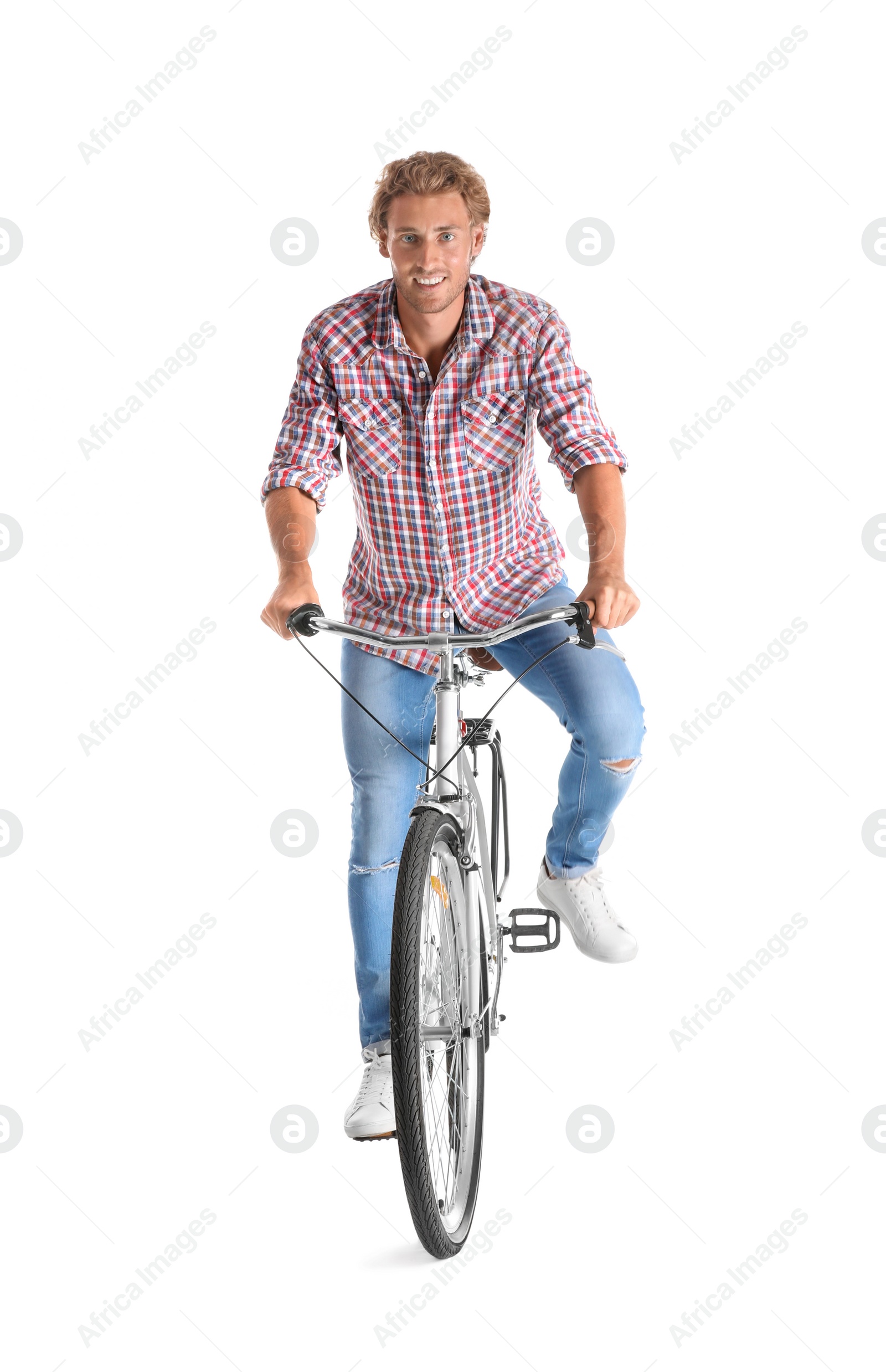 Photo of Handsome young man riding bicycle on white background