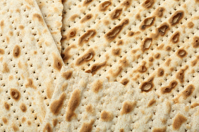 Photo of Traditional Matzos as background, top view. Pesach (Passover) celebration