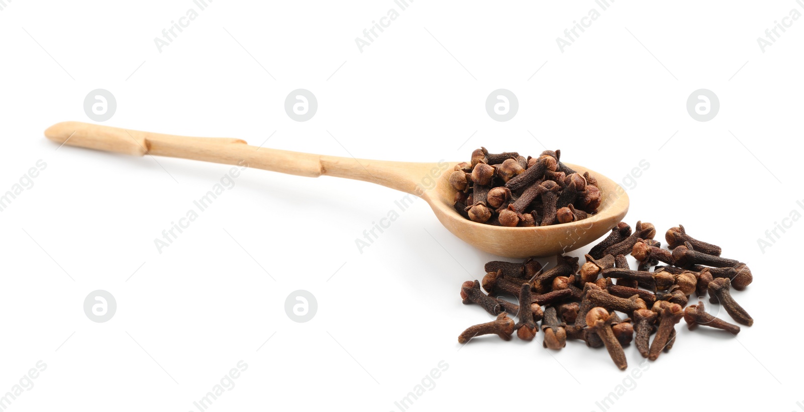 Photo of Pile of aromatic dry cloves and wooden spoon on white background