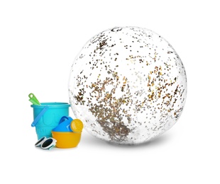 Photo of Beach ball and plastic toys on white background