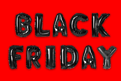Image of Text BLACK FRIDAY made of foil balloons on red background