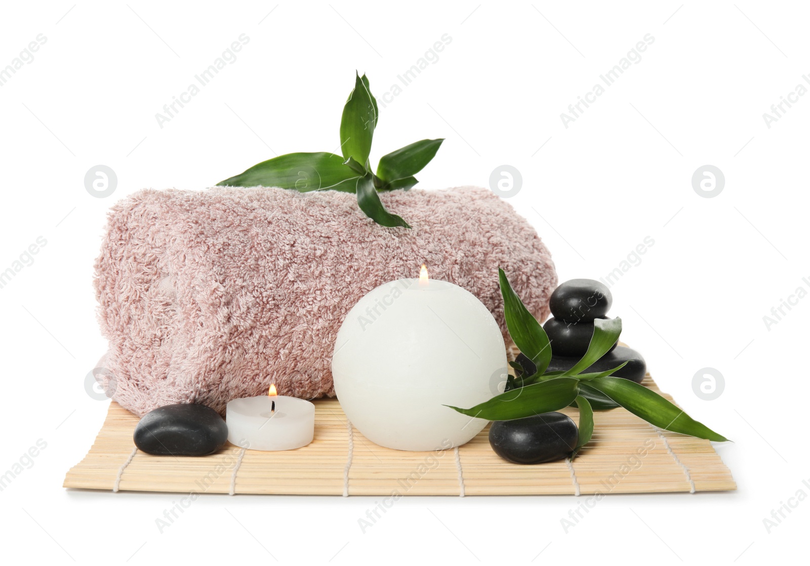 Photo of Beautiful spa composition with candles and towel on white background