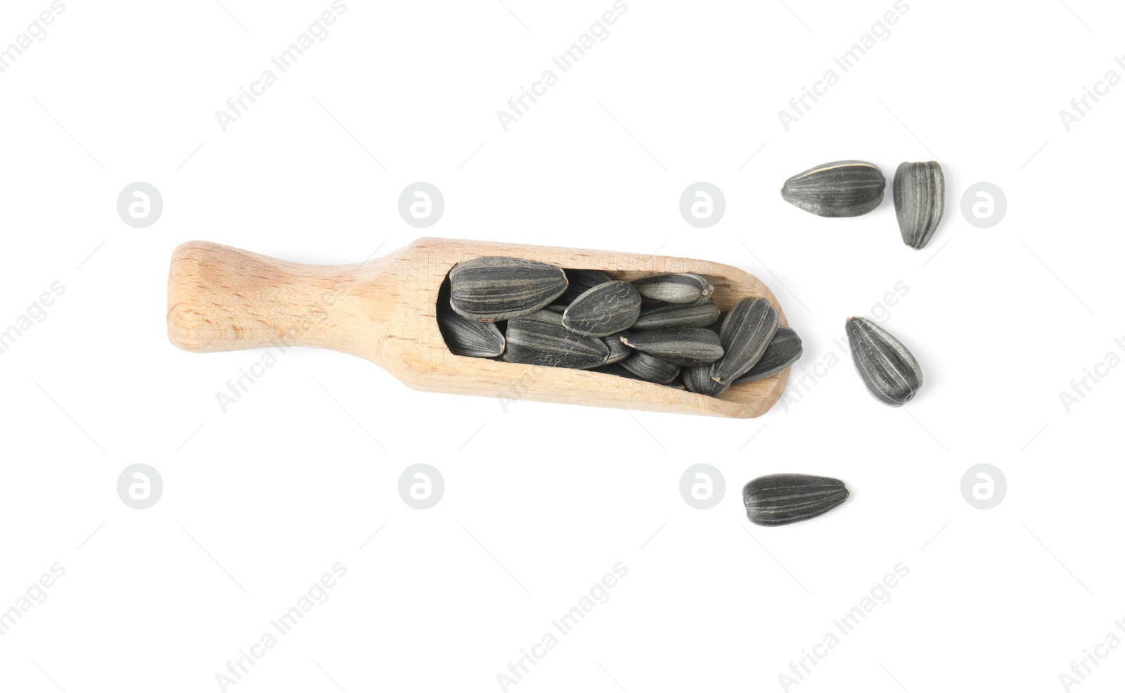 Photo of Raw organic sunflower seeds in wooden scoop isolated on white, top view