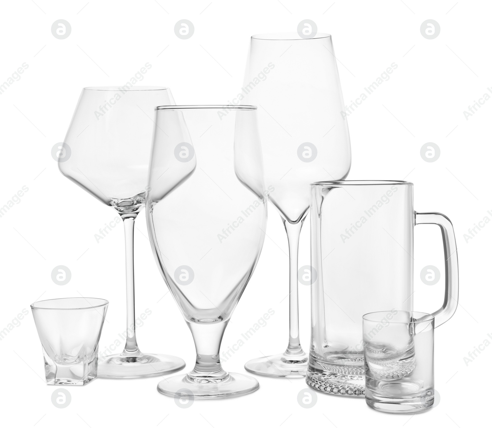 Photo of Different elegant empty glasses isolated on white