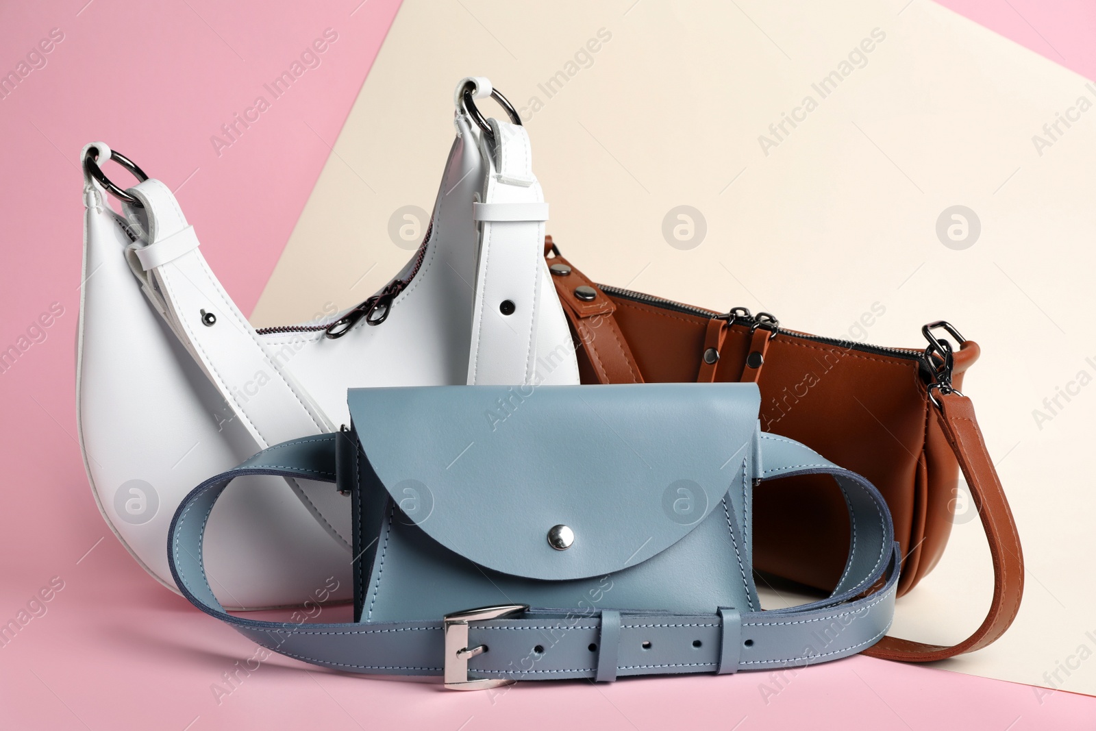 Photo of Different stylish woman's bags on color background