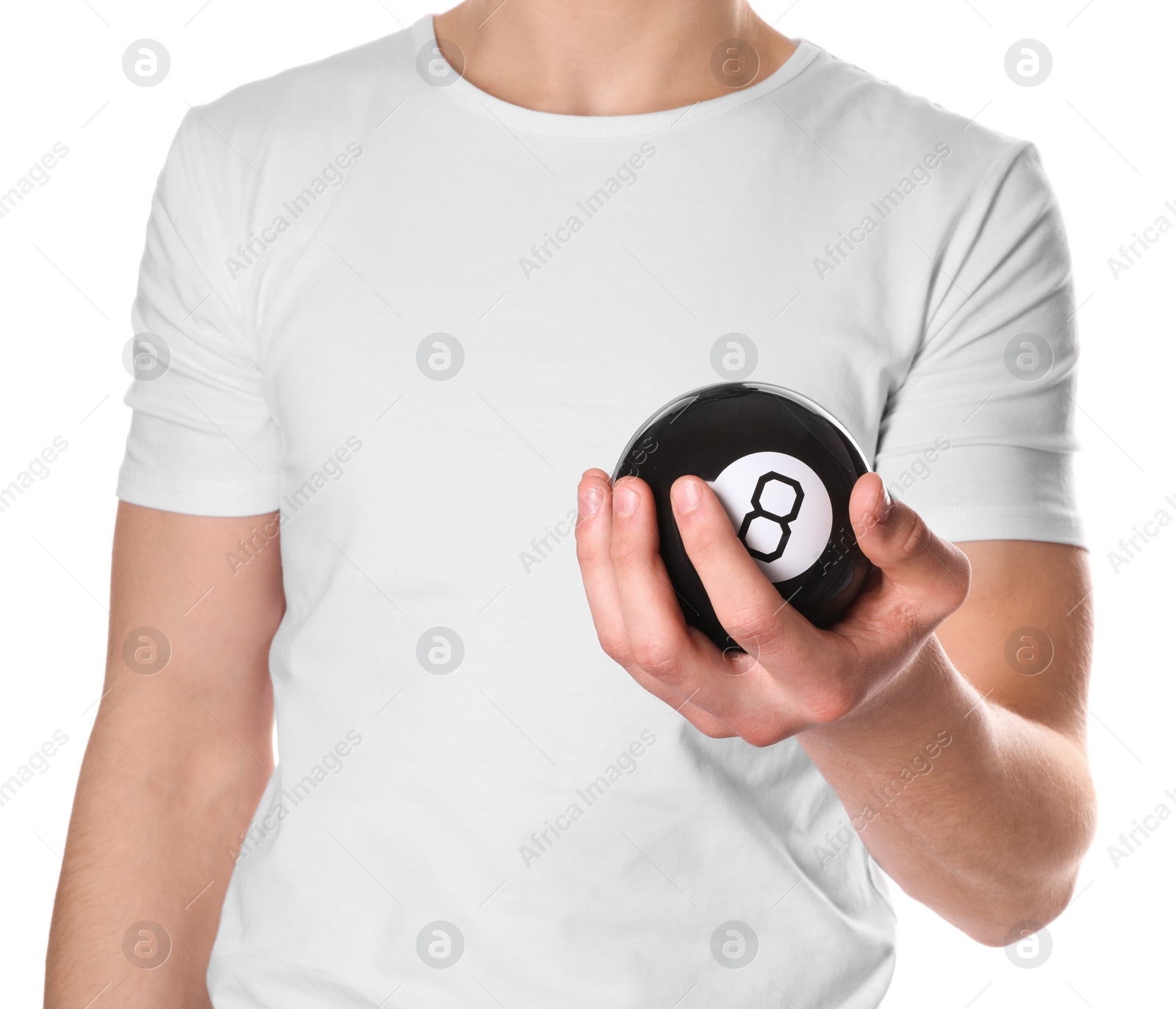Photo of Man holding magic eight ball on white background, closeup