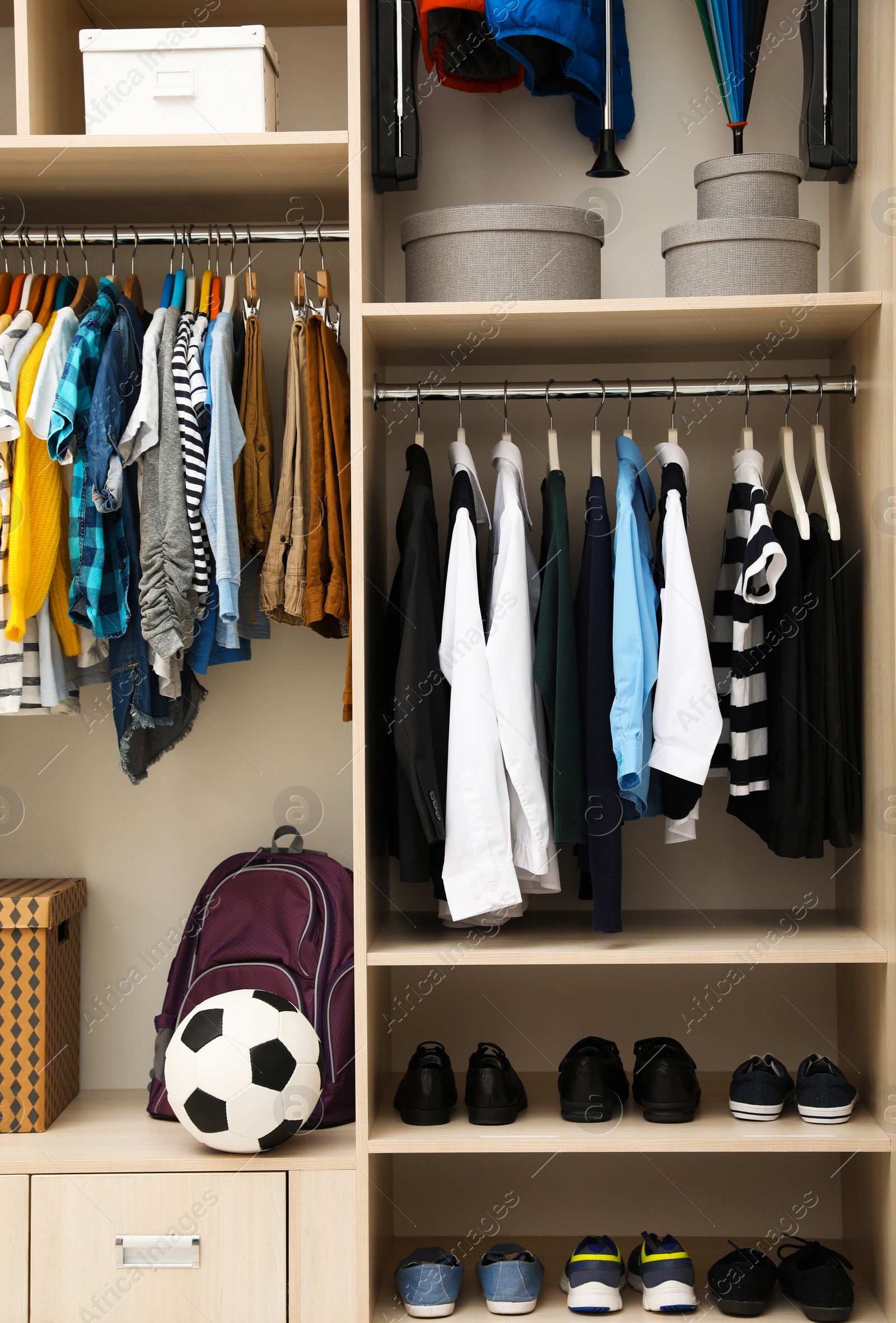 Photo of Large wardrobe with teenager clothes, shoes and accessories