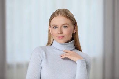 Photo of Portrait of beautiful young woman at home