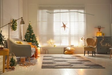 Photo of Stylish room with Christmas decorations. Festive interior design