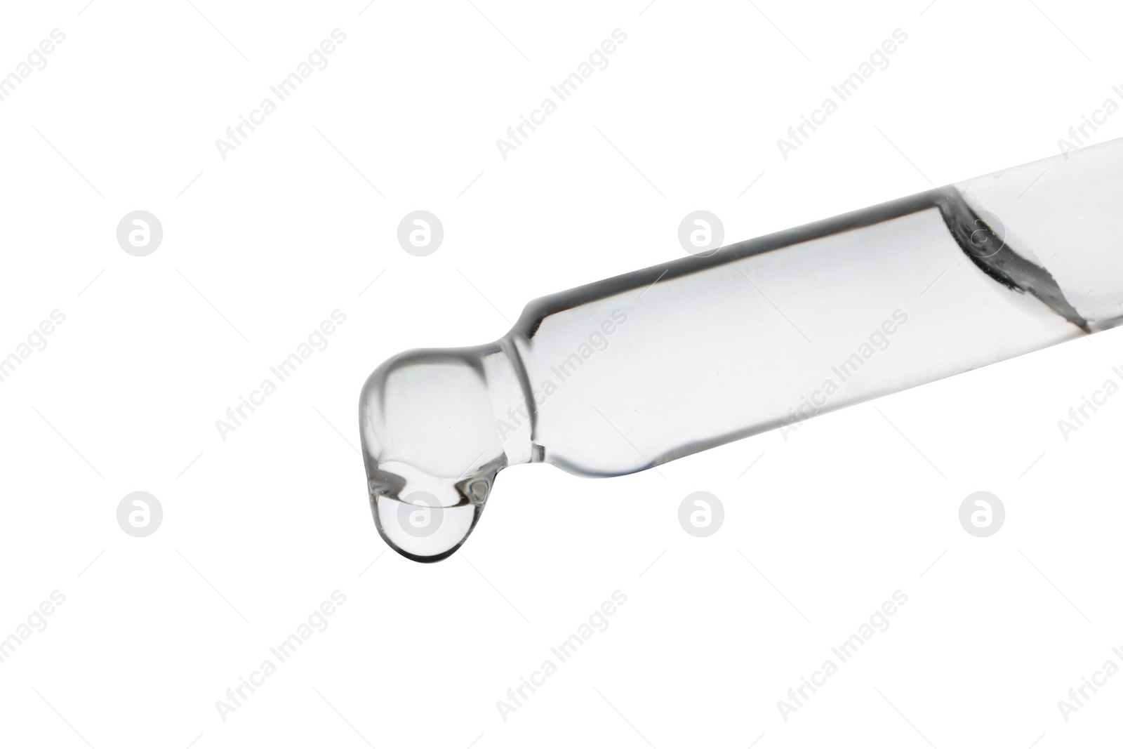 Photo of Dripping clear facial serum from pipette on white background, closeup