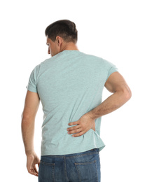 Photo of Man suffering from lower back pain on white background. Visiting orthopedist
