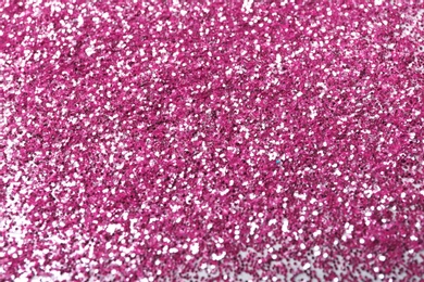 Photo of Closeup view of sparkling pink glitter background