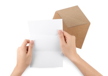 Woman holding blank letter on white background, top view