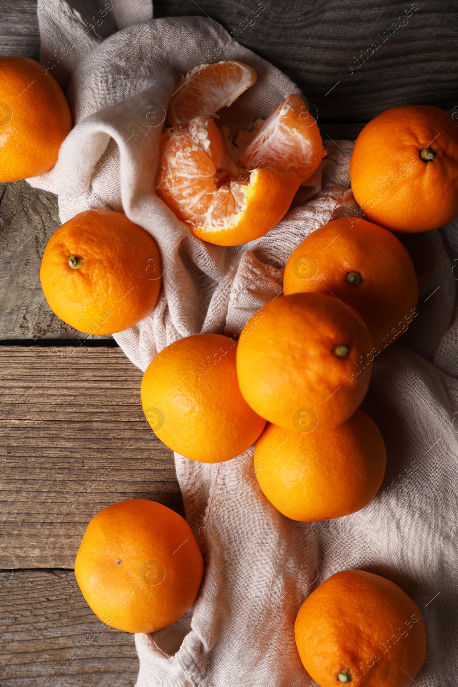 Photo of Tasty fresh tangerines on wooden table, flat lay