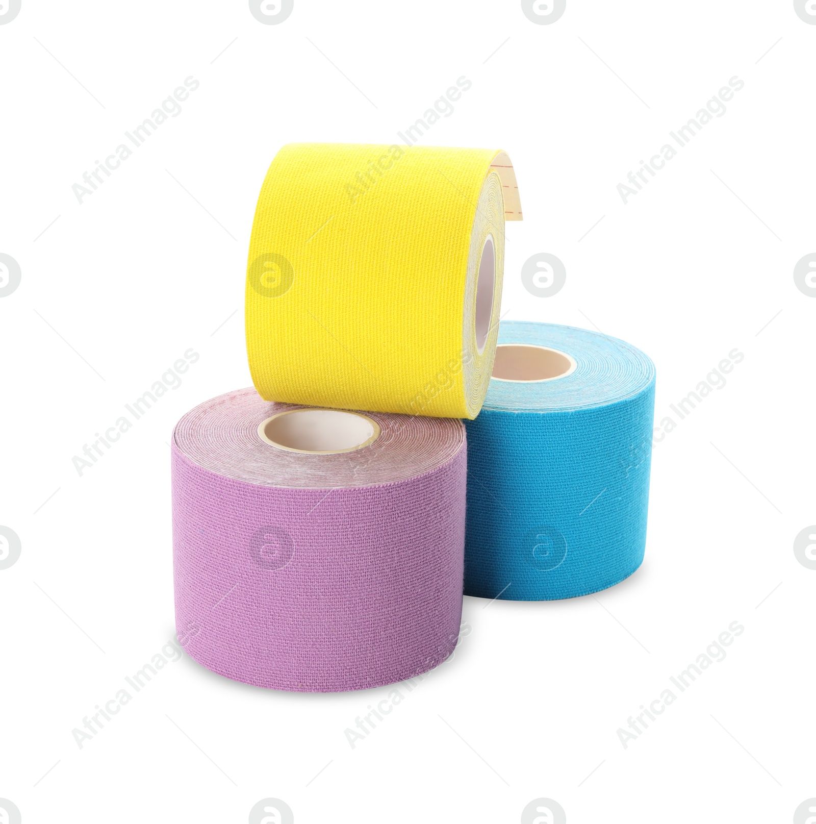 Photo of Many bright kinesio tape in rolls on white background