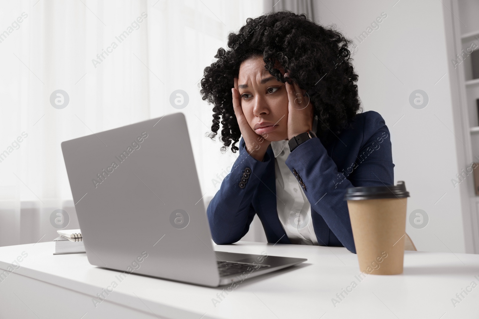 Photo of Deadline concept. Stressed woman working with laptop in office