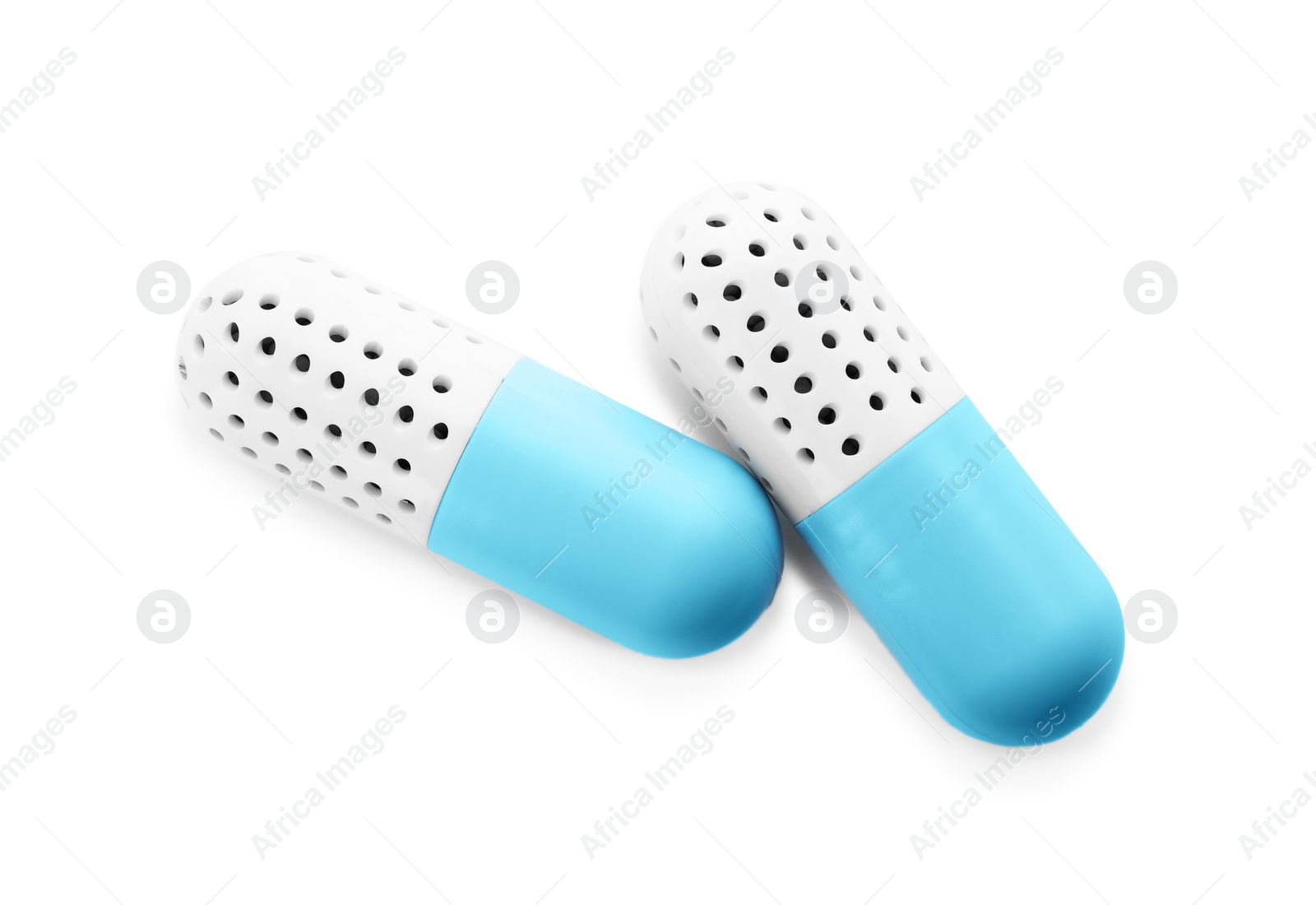 Photo of Capsule shoe fresheners on white background, top view