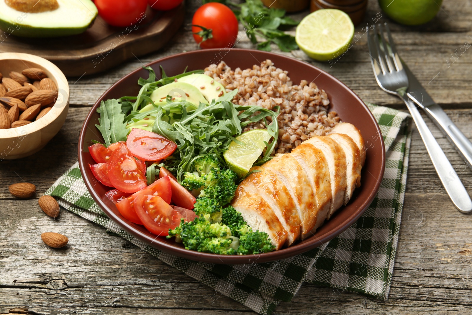 Photo of Healthy meal. Tasty products in bowl on wooden table