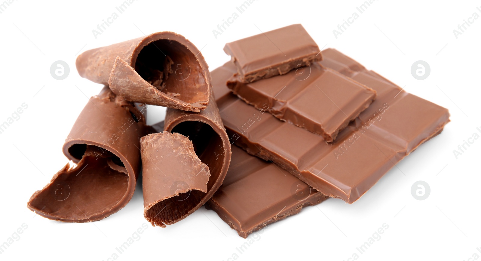 Photo of Pieces of tasty chocolate bar and shavings isolated on white