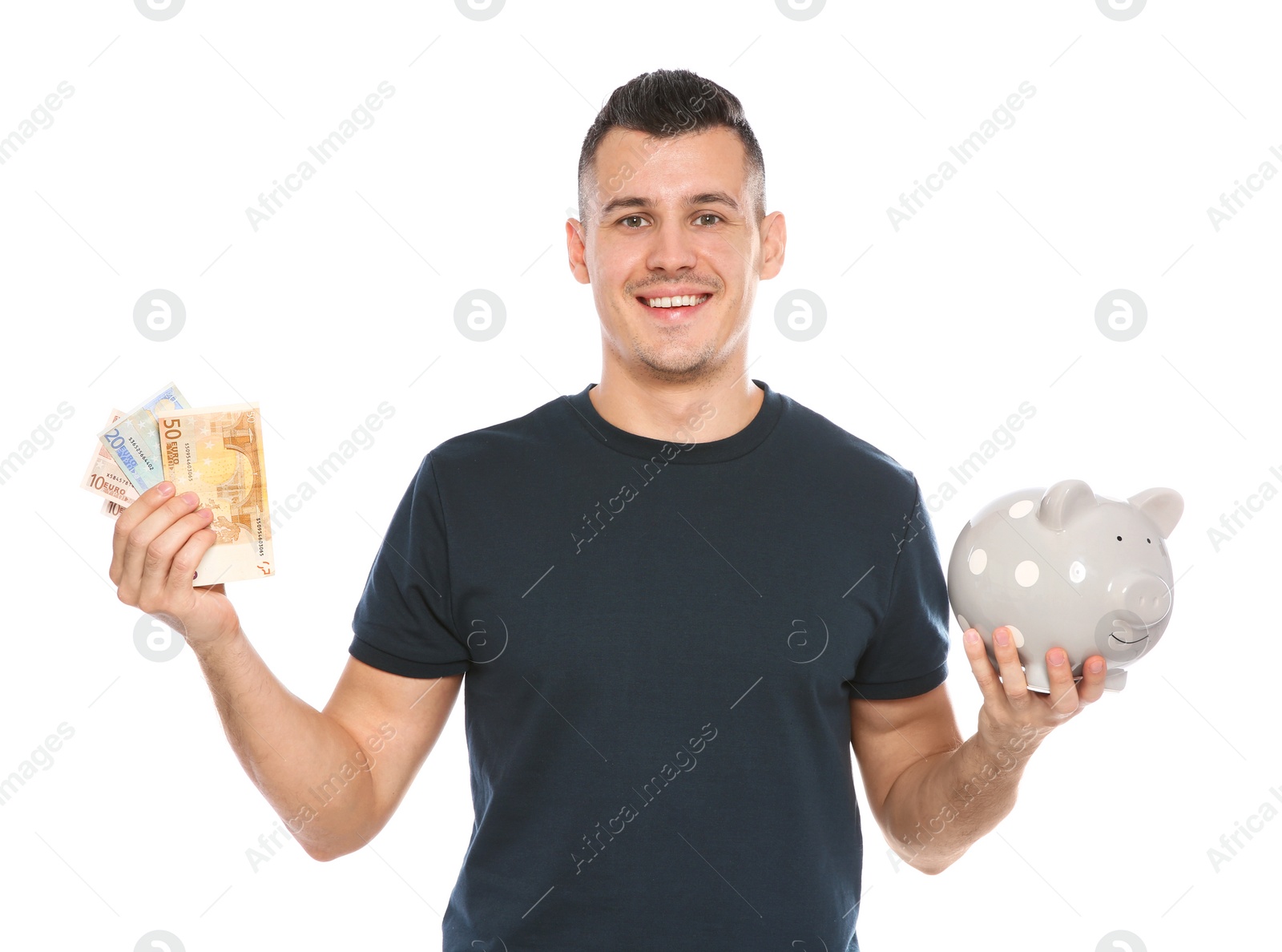 Photo of Portrait of young man with piggy bank and money on white background