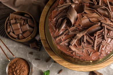 Flat lay composition with tasty chocolate cake on table