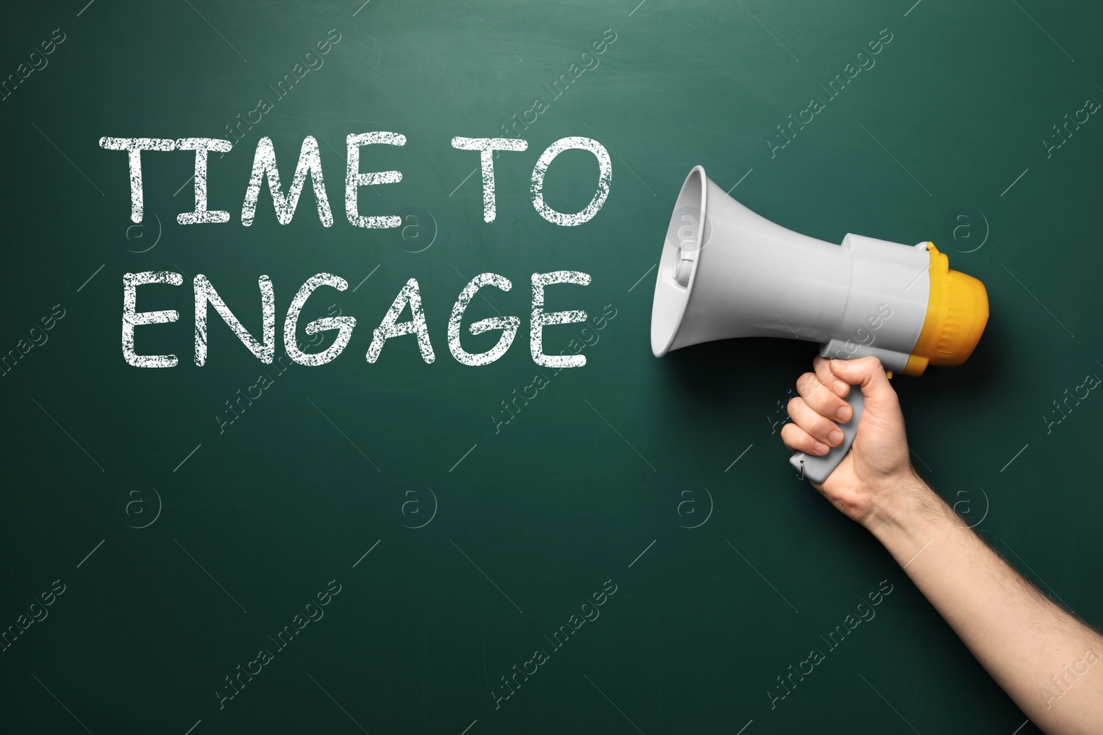 Image of Man holding megaphone near chalkboard with text Time To Engage