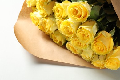 Beautiful bouquet of yellow roses on white background, closeup