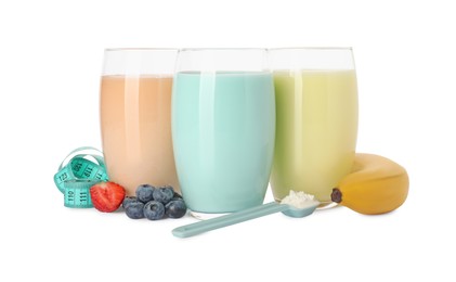 Photo of Tasty shakes, banana, berries, measuring tape and powder isolated on white. Weight loss