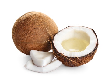 Photo of Ripe coconuts on white background. Natural organic oil