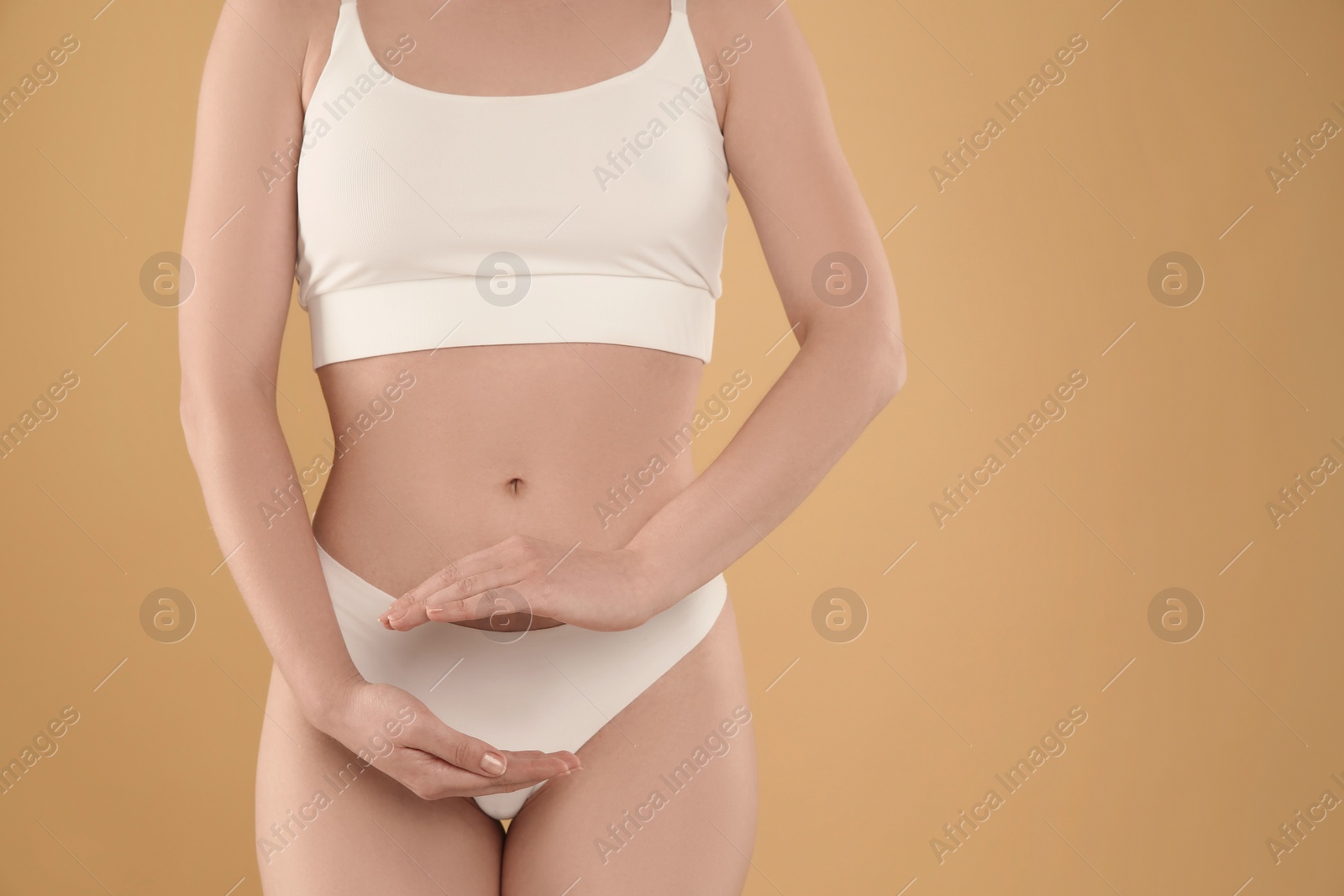 Photo of Gynecology. Woman in underwear on yellow background, closeup. Space for text