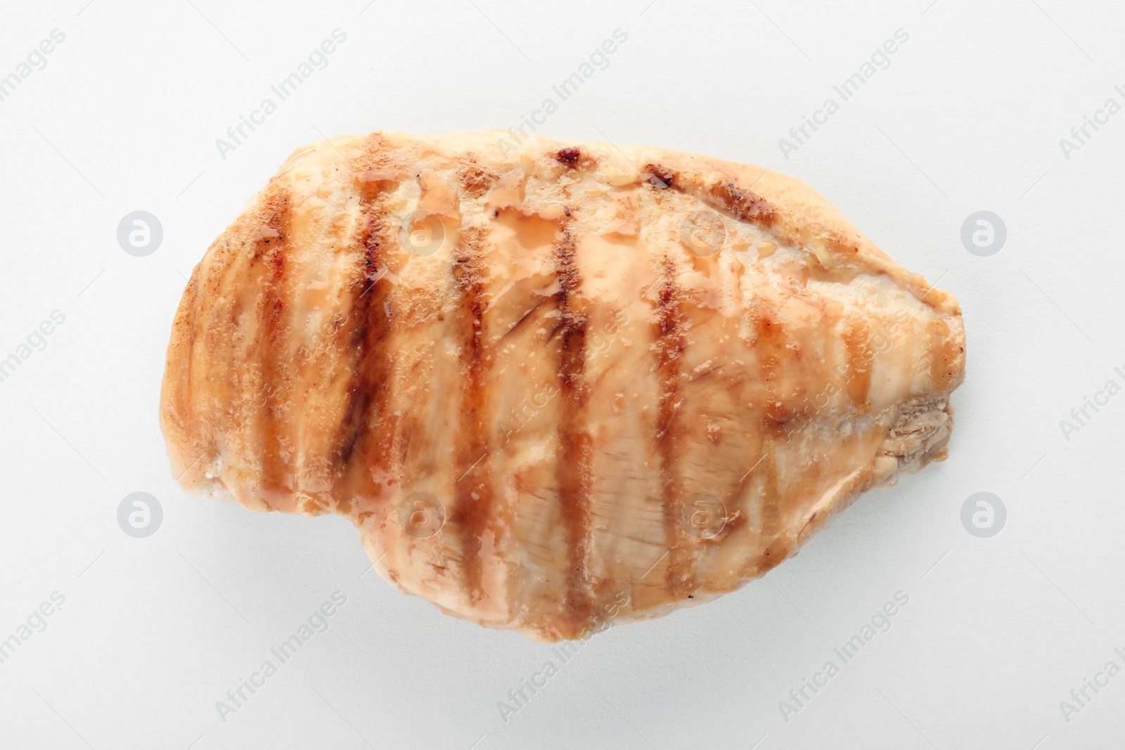 Photo of Delicious grilled meat on white background, top view