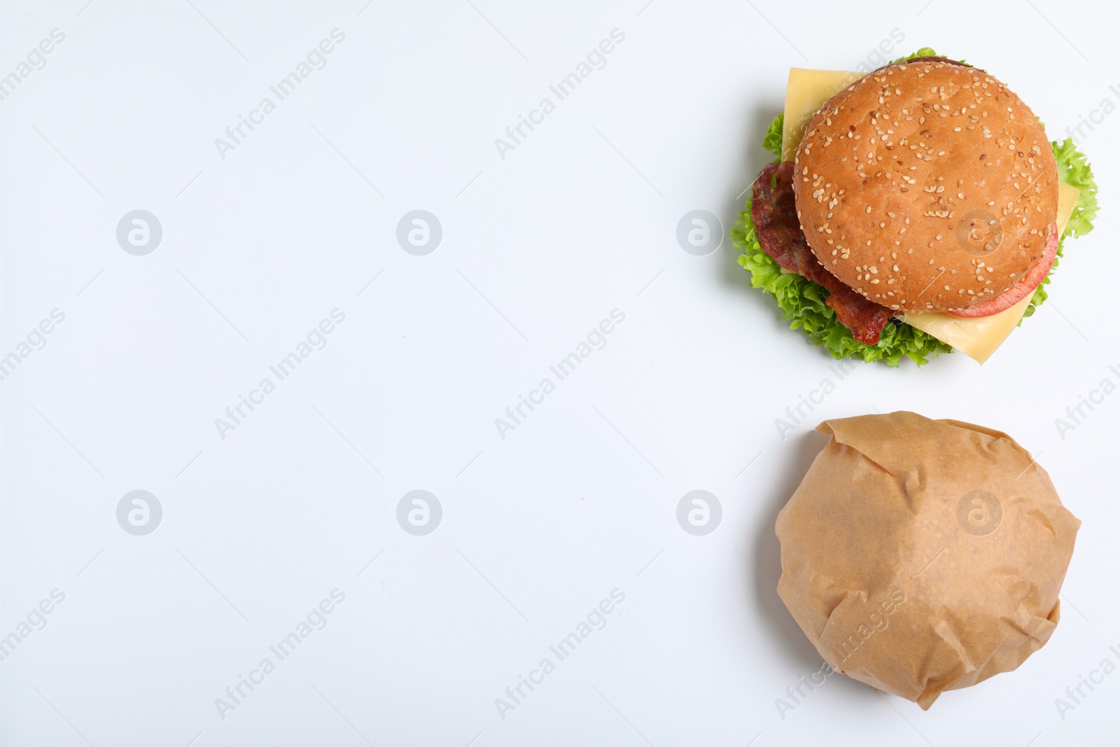 Photo of Fresh burgers on white background, top view