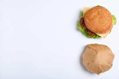 Photo of Fresh burgers on white background, top view