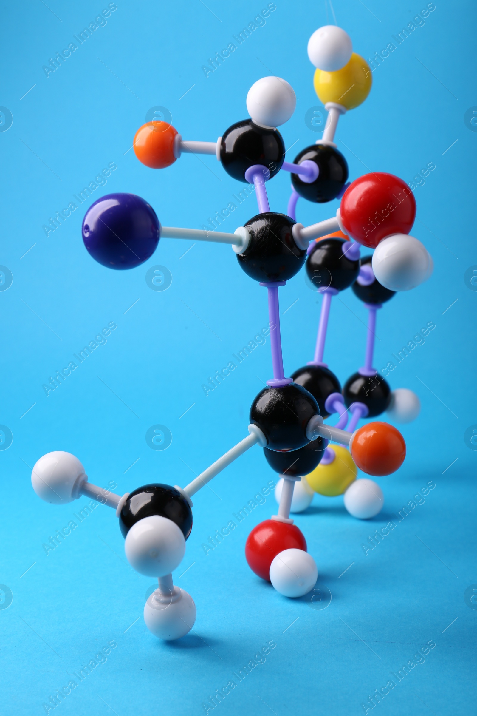 Photo of Structure of molecule on light blue background. Chemical model