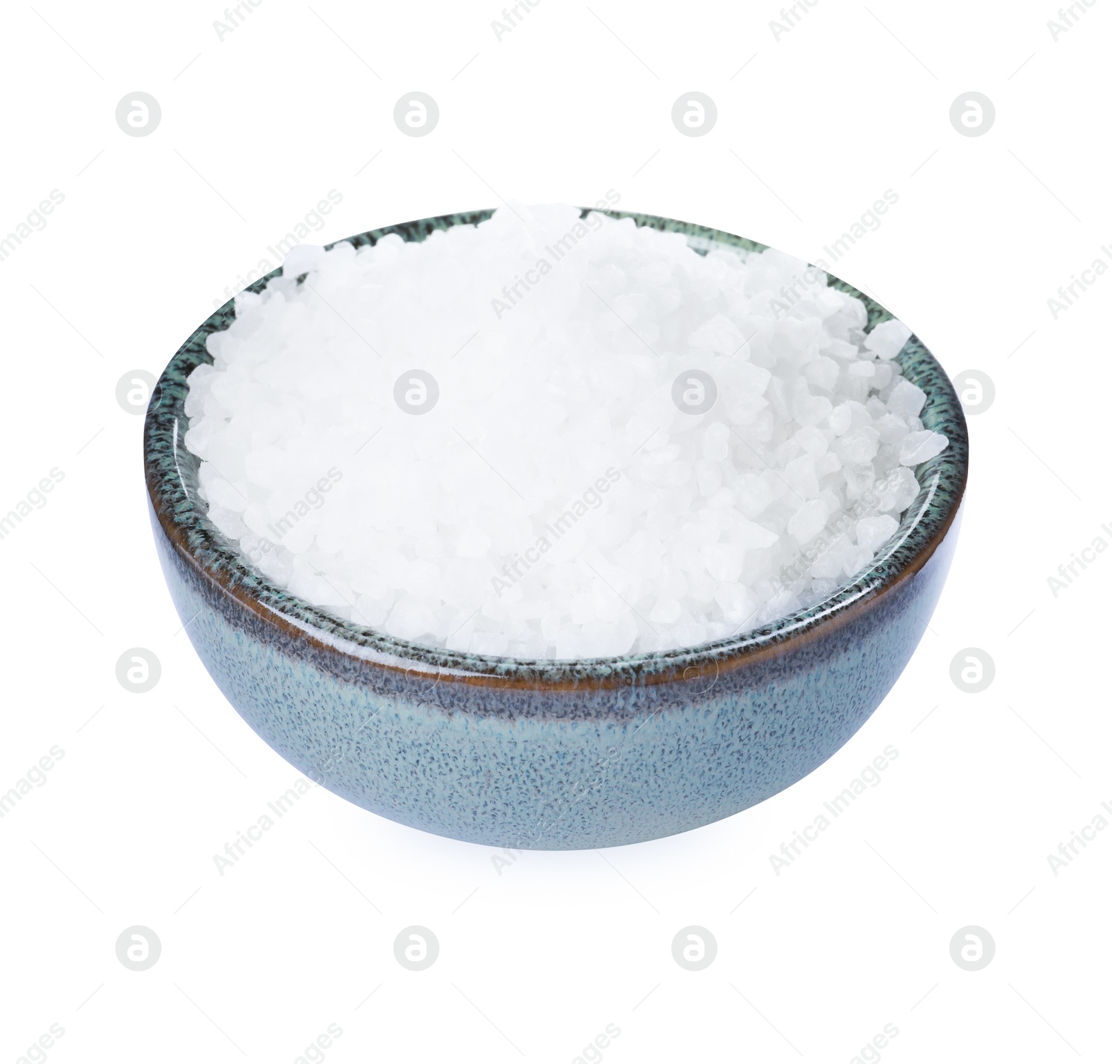 Photo of Ceramic bowl with natural sea salt isolated on white