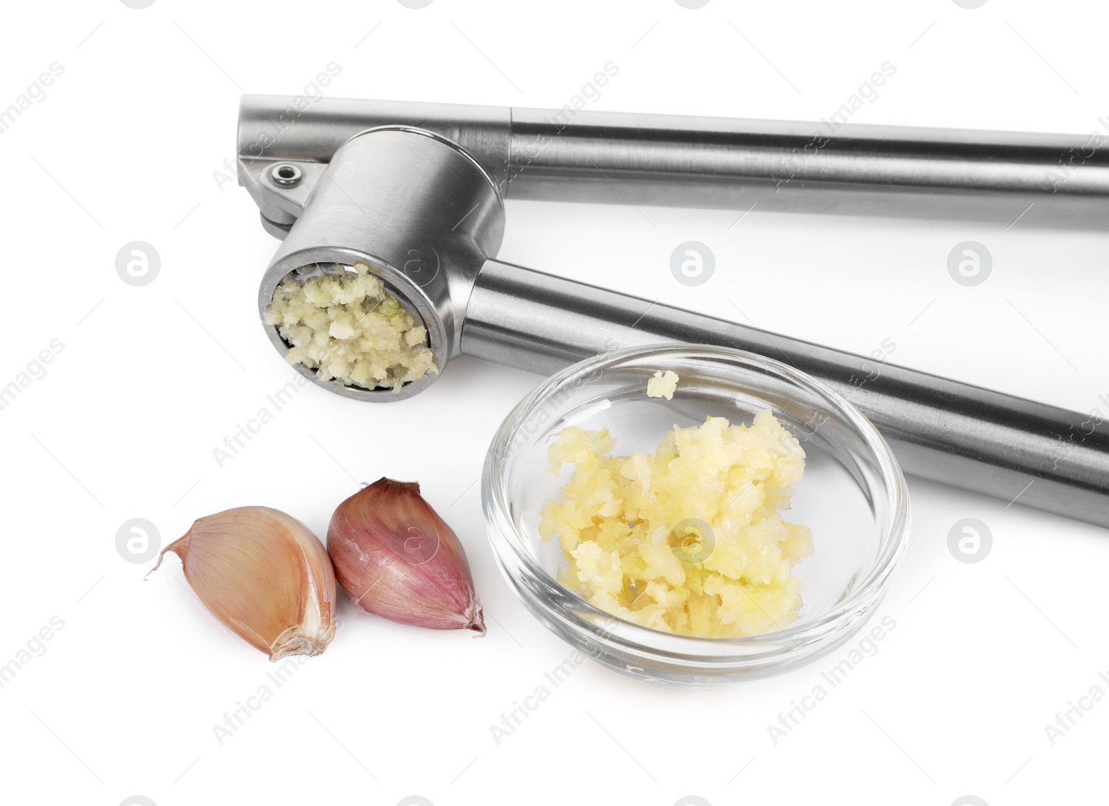 Photo of One metal press and garlic isolated on white