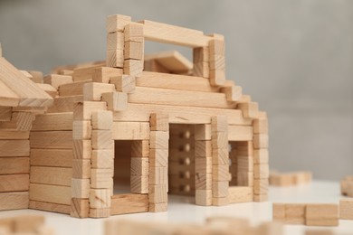 Wooden construction set on white table, closeup. Children's toy