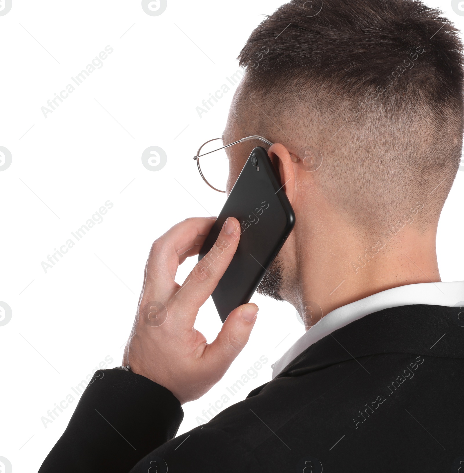 Photo of Businessman in glasses talking on smartphone against white background