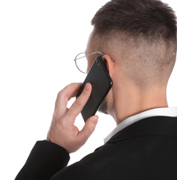 Photo of Businessman in glasses talking on smartphone against white background