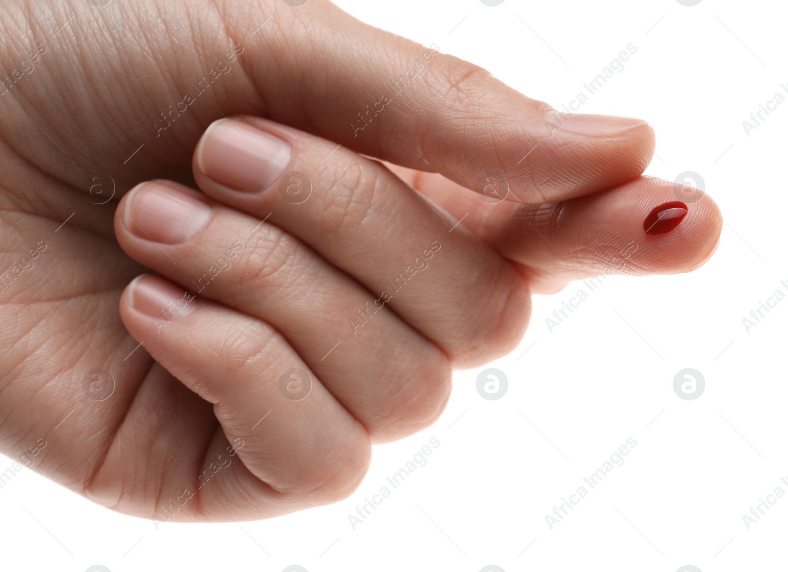 Photo of Woman with pricked finger and blood drop on white background, closeup