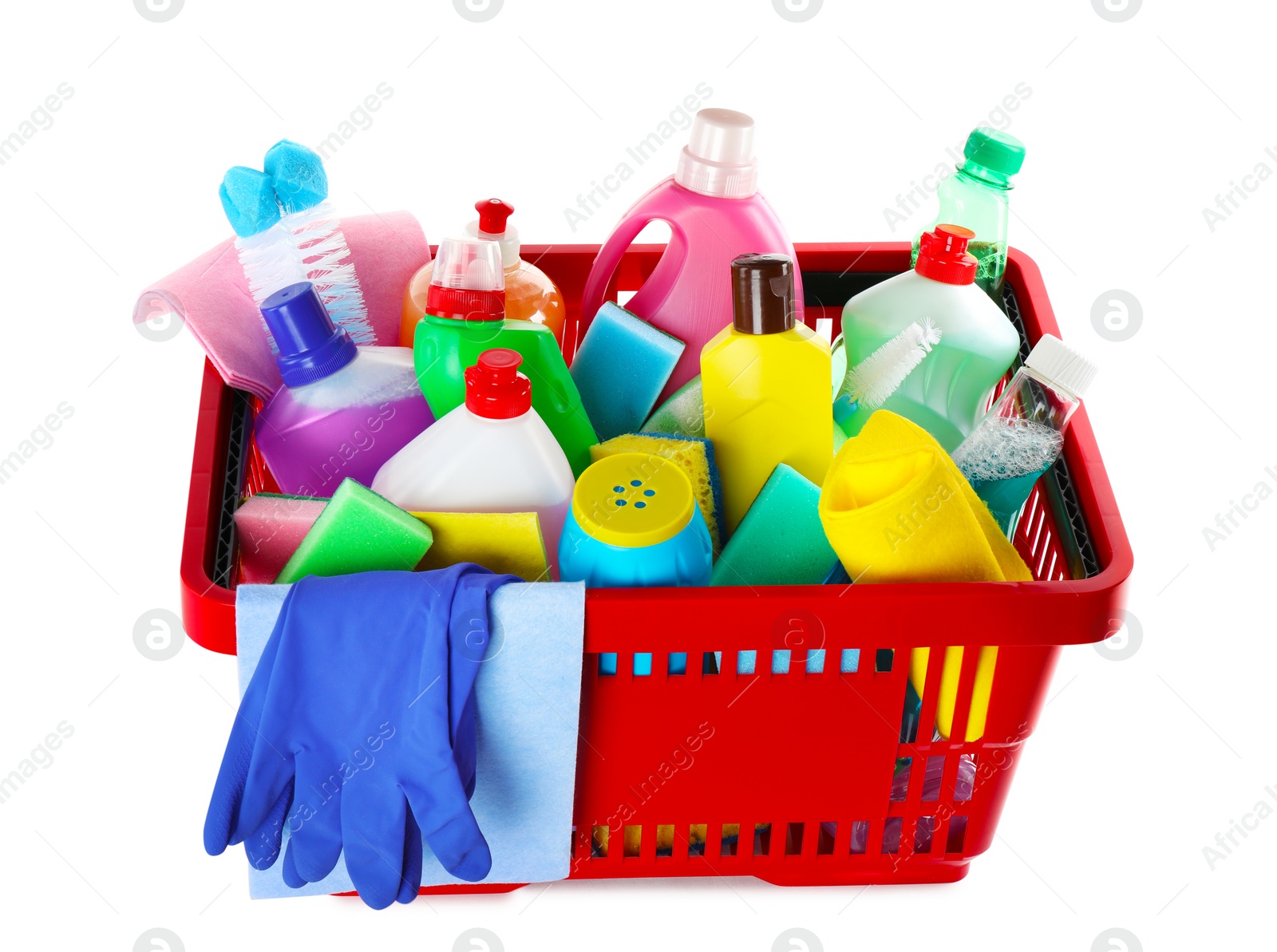 Photo of Shopping basket with different detergents, rag and gloves on white background