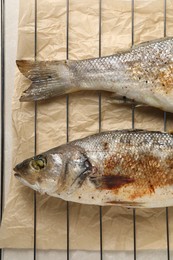 Photo of Baked fish on cooling rack, flat lay