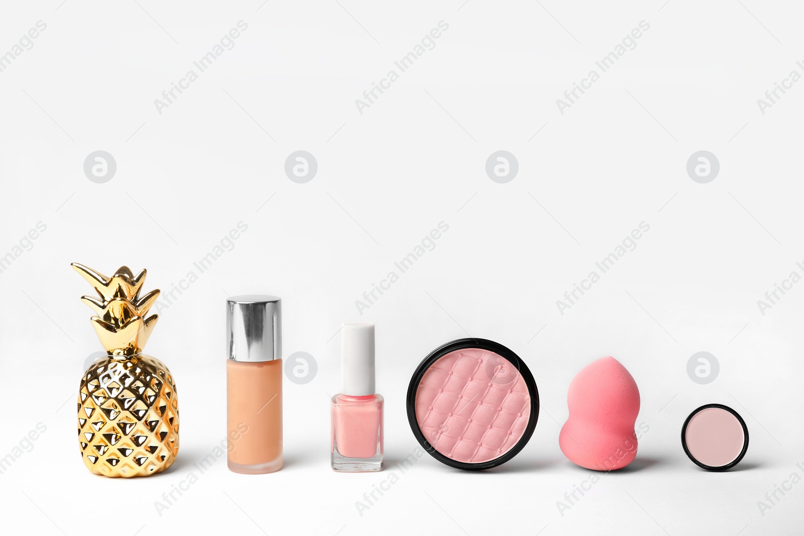 Photo of Decorative makeup products on white background